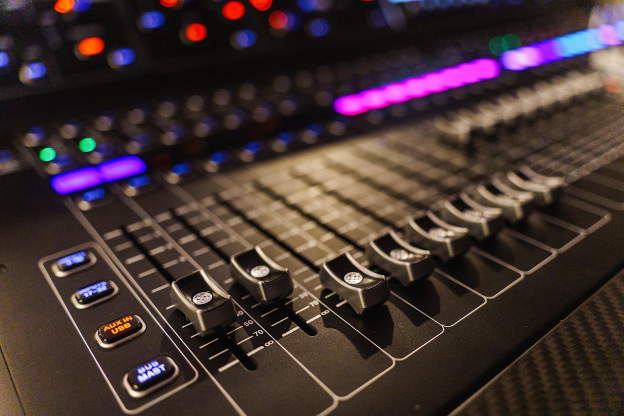 services-02 Detailed view of an advanced audio mixing console, perfect for studios.
